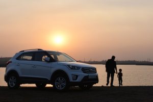 silhouette-of-man-and-child-near-white-hyundai-tucson-suv-1134857